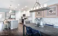 3405 Rendevous Bay Drive, Shallotte, NC 28470 — 5-bedroom home in Solserra, Shallotte, NC, photo 2 of 26: Cafe to Kitchen