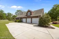 119 Arbon Lane, New Bern, NC 28562 — 4-bedroom home in Taberna, New Bern, NC, photo 6 of 67: triple car side entrance garage