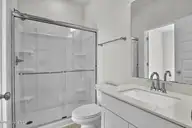 6825 Fellowship Drive, Leland, NC 28451 — 5-bedroom home in Grand Park, Leland, NC, photo 15 of 31: Downstairs Guest Suite Bathroom