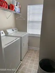 309 Basil Court, Hubert, NC 28539 — 3-bedroom home in Sagewood, Hubert, NC, photo 11 of 27: 309 basil laundry