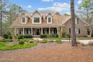 54 Abbottsford Drive, Pinehurst, NC 28374 — 4-bedroom home in Pinewild CC, Pinehurst, NC, photo 1 of 65: Front Elevation