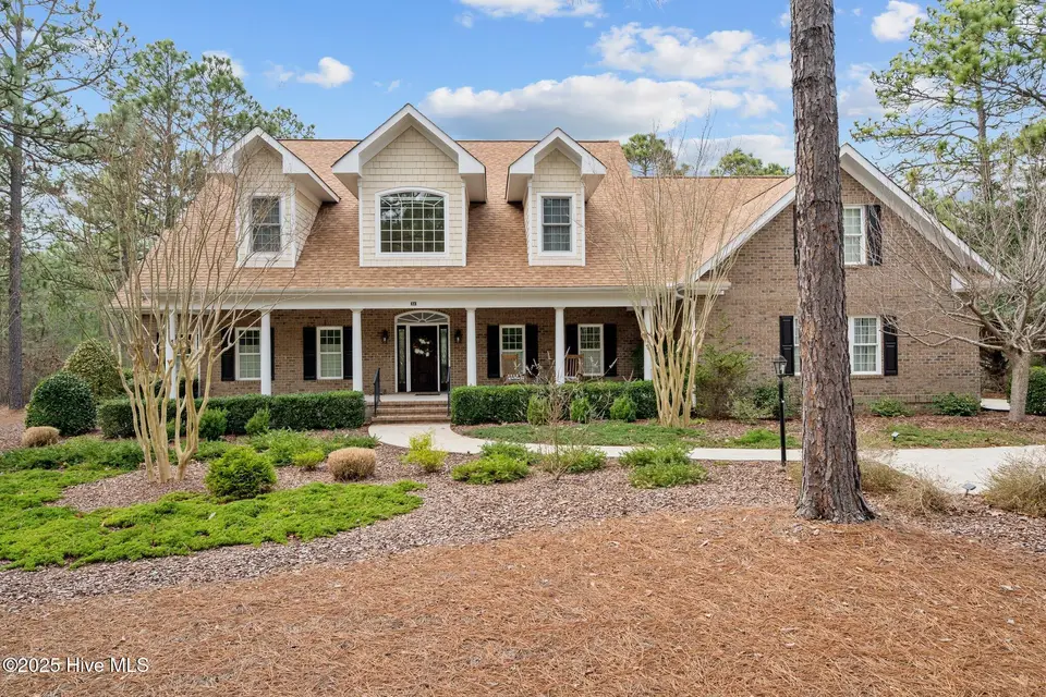 54 Abbottsford Drive, Pinehurst, NC 28374 — 4-bedroom home in Pinewild CC, Pinehurst, NC, photo 1 of 65: Front Elevation
