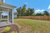 174 Planters Walk, Hampstead, NC 28443 — 4-bedroom waterfront home in East Wynd, Hampstead, NC, photo 23 of 32: Backyard 1