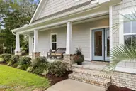 1748 Oakbrook Drive SW, Ocean Isle Beach, NC 28469 — 4-bedroom home in Brick Landing, Ocean Isle Beach, NC, photo 5 of 77: Inviting Entrance