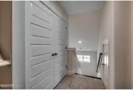 511 Heart Pine Avenue, Wilmington, NC 28411 — 3-bedroom home in Indigo at Abbey Preserve, Wilmington, NC, photo 22 of 27: Upstairs Hallway