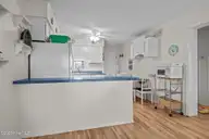 301 E Commerce Way Road 357, Atlantic Beach, NC 28512 — 2-bedroom waterfront condo in Sea Spray, Atlantic Beach, NC, photo 8 of 22: Kitchen with Bar Counter