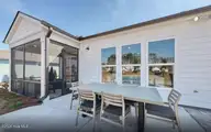 3407 Discovery Bay Road, Shallotte, NC 28470 — 4-bedroom home in Solserra, Shallotte, NC, photo 21 of 31: Screened Porch & Patio