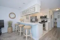 9100 Reed Drive 3202, Emerald Isle, NC 28594 — 1-bedroom waterfront condo in Queens Court, Emerald Isle, NC, photo 22 of 52: Virtual Staging