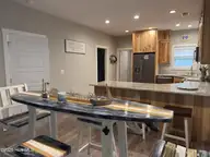 669 Pelican Circle, Bolivia, NC 28422 — 3-bedroom waterfront home in River Run Plantation, Bolivia, NC, photo 5 of 25: Dining area