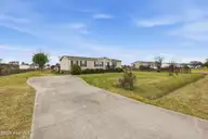 124 Zack Circle, Elizabeth City, NC 27909 — 3-bedroom manufactured home in Red Oak, Elizabeth City, NC, photo 2 of 36: 124 Zack Circle Driveway