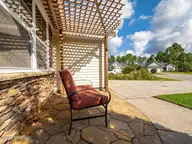 423 Blue Pennant Court, Sneads Ferry, NC 28460 — 3-bedroom home in Oyster Landing, Sneads Ferry, NC, photo 13 of 35: Front Patio