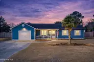 319 Riggs Road, Hubert, NC 28539 — 3-bedroom home in Huntington Marsh, Hubert, NC, photo 1 of 68: Twilight photo