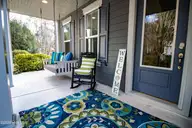 9095 Devaun Park Boulevard SW, Calabash, NC 28467 — 3-bedroom home in Devaun Park, Calabash, NC, photo 5 of 52: Front Porch