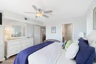 9201 Coast Guard Road A208, Emerald Isle, NC 28594 — 3-bedroom waterfront condo in Pebble Beach, Emerald Isle, NC, photo 18 of 45: Primary suite with deck access
