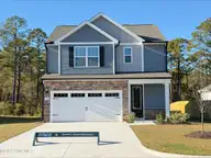 124 S Umbrella Palm Drive, Hampstead, NC 28443 — 3-bedroom home in Southwater Village, Hampstead, NC, photo 1 of 21: 124 Umbrella Palm