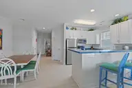 2555 St James Drive SE Unit 101, Southport, NC 28461 — 3-bedroom condo in St James, Southport, NC, photo 9 of 53: Kitchen / Dining