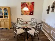 330 S Middleton Drive NW Unit 505, Calabash, NC 28467 — 2-bedroom waterfront condo in Brunswick Plantation, Calabash, NC, photo 16 of 72: 505 dining room 3