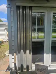 8248 Highway 70, Newport, NC 28570 — 2-bedroom home in Pine Acres, Newport, NC, photo 7 of 30: Mabe Storm Shutters