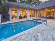 8900 Mahogany Run, Wilmington, NC 28411 — 3-bedroom home in Porters Neck Plantation, Wilmington, NC, photo 3 of 75: 98-web-or-mls-03_T04_pool-and-covered-te