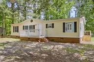 211 Pond Road, Rocky Point, NC 28457 — 3-bedroom manufactured home in Arvida Lands, Rocky Point, NC, photo 2 of 36: 2_front exterior