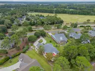 1806 Urchin Lane SE, Bolivia, NC 28422 — 3-bedroom waterfront home in Winding River Plantation, Bolivia, NC, photo 3 of 61: aerial 1