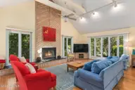 579 Coral Ridge Road, Pine Knoll Shores, NC 28512 — 4-bedroom waterfront home in Beacon's Reach, Pine Knoll Shores, NC, photo 8 of 62: Living Room Area w/ Vaulted Ceilings
