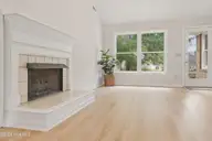 312 Wendover Lane, Wilmington, NC 28411 — 3-bedroom home in Wendover, Wilmington, NC, photo 7 of 35: LR fireplace+deck door