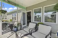9410 Barnstormer Drive NW, Calabash, NC 28467 — 3-bedroom home in Eagle Run, Calabash, NC, photo 21 of 47: Screened-in Porch