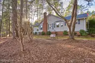 171 Pine Ridge Drive, Whispering Pines, NC 28327 — 3-bedroom waterfront home in Whispering Pines, Whispering Pines, NC, photo 1 of 65: front