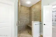 1454 Dunes Boulevard SW, Ocean Isle Beach, NC 28469 — 4-bedroom home in Retreat At OIB, Ocean Isle Beach, NC, photo 20 of 52: Large primary shower