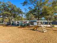 182 Lake Drive SW, Supply, NC 28462 — 2-bedroom manufactured home in Riverside, Supply, NC, photo 9 of 46: Front Yard