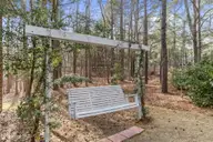 245 Firetree Lane, Seven Lakes, NC 27376 — 3-bedroom home in Seven Lakes North, Seven Lakes, NC, photo 20 of 27: Porch swing