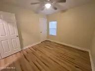 502 Wesley Avenue, Wilmington, NC 28403 — 3-bedroom home in Hillsdale, Wilmington, NC, photo 22 of 37: bedroom 1 closet door