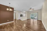 119 Covil Avenue Unit 103, Wilmington, NC 28403 — 2-bedroom condo in Covil Garden Condominiums, Wilmington, NC, photo 5 of 33: Dining Area to Living Room