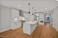 3804 Emerald Drive E, Emerald Isle, NC 28594 — 4-bedroom waterfront townhome in Emerald Isle By The Sea, Emerald Isle, NC, photo 10 of 46: Kitchen Open to Living Room