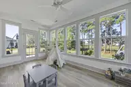524 Moss Lake Lane, Holly Ridge, NC 28445 — 5-bedroom waterfront home in Summerhouse On Everett Bay, Holly Ridge, NC, photo 18 of 71: 63_sun room