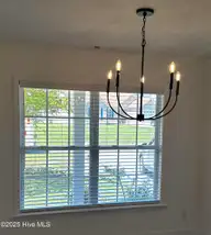 4930 N Hampton Drive SE, Southport, NC 28461 — 3-bedroom waterfront home in Carolina Place, Southport, NC, photo 10 of 58: New faux wood blinds