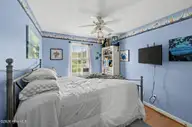 121 NE 6th Street, Oak Island, NC 28465 — 3-bedroom home in Tranquil Harbor, Oak Island, NC, photo 14 of 21: 27_121_NE_6th_St-Bedroom-GE58