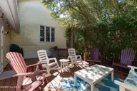 579 Coral Ridge Road, Pine Knoll Shores, NC 28512 — 4-bedroom waterfront home in Beacon's Reach, Pine Knoll Shores, NC, photo 17 of 62: Outdoor Deck w/ Seating Area