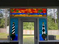 122 Ballantine Grove Lane, Newport, NC 28570 — 4-bedroom home in Ballantine Grove, Newport, NC, photo 7 of 21: Back Porch Stained Glass