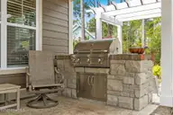 2585 Parkridge Drive, Southport, NC 28461 — 4-bedroom waterfront home in St James, Southport, NC, photo 7 of 77: Artisan Outdoor Grill Conveys