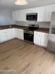 7009 Banister Loop, Jacksonville, NC 28546 — 2-bedroom townhome in The Gables, Jacksonville, NC, photo 1 of 25