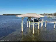 615 Willbrook Circle, Sneads Ferry, NC 28460 — 3-bedroom waterfront home in New River Plantation, Sneads Ferry, NC, photo 10 of 48: Boat lift and dock
