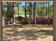 472 Maplewood Drive NW, Calabash, NC 28467 — 3-bedroom manufactured home in Ocean Forest, Calabash, NC, photo 2 of 37: Yard Edited_3