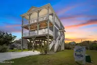 1517 Wahoo Street, North Topsail Beach, NC 28460 — 4-bedroom waterfront home in Soundside Park @ North Topsail Beach, North Topsail Beach, NC, photo 1 of 44: 70-web-or-mls-Virtual Dusk_2