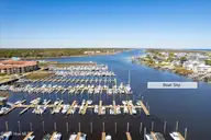 215 Silver Sloop Way, Carolina Beach, NC 28428 — 3-bedroom waterfront townhome in Harbour Point, Carolina Beach, NC, photo 2 of 52: 12-FinalDroneJonathanCB-12