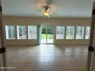 103 Castelnau Court, Jacksonville, NC 28540 — 5-bedroom home in Williamsburg Plantation, Jacksonville, NC, photo 14 of 52: 8. Sunroom B
