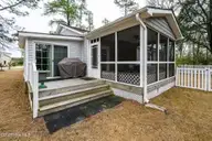 6203 Gondolier Drive, New Bern, NC 28560 — 3-bedroom home in Fairfield Harbour, New Bern, NC, photo 24 of 68: Back Deck & Screened Porch