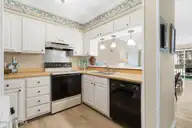 1904 E Fort Macon Road 156, Atlantic Beach, NC 28512 — 2-bedroom waterfront condo in APATB, Atlantic Beach, NC, photo 11 of 54: Kitchen overlooking Living Room