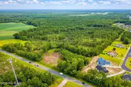38.77 Ac Hickman Road NW, Calabash, NC 28467 — lot in Hickmans Crossing, Calabash, NC, photo 1 of 8: ChatGPT Image Jan 6, 2026, 08_55_16 AM